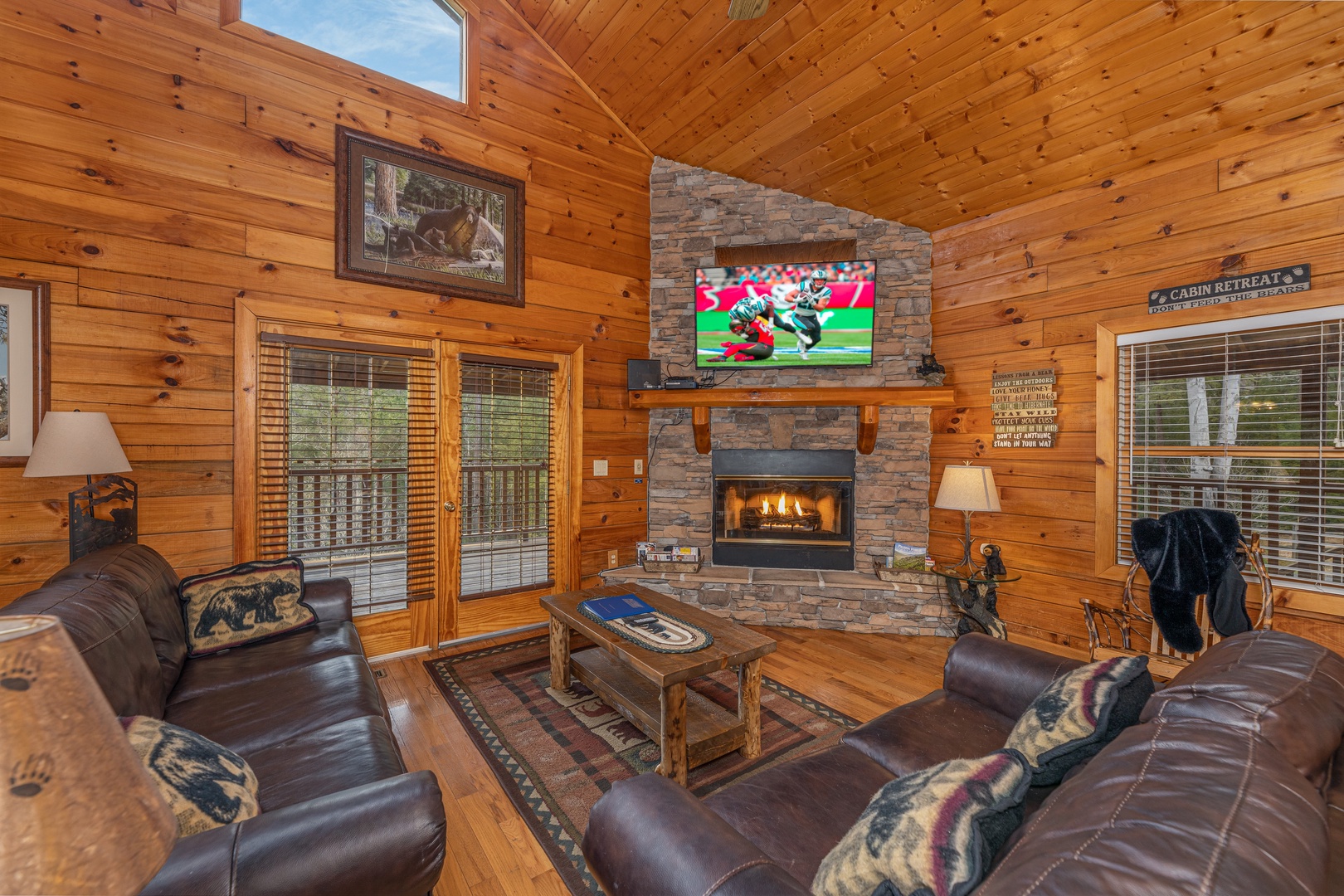 Fireplace and TV in a living room at Almost Bearadise, a 4 bedroom cabin rental located in Pigeon Forge