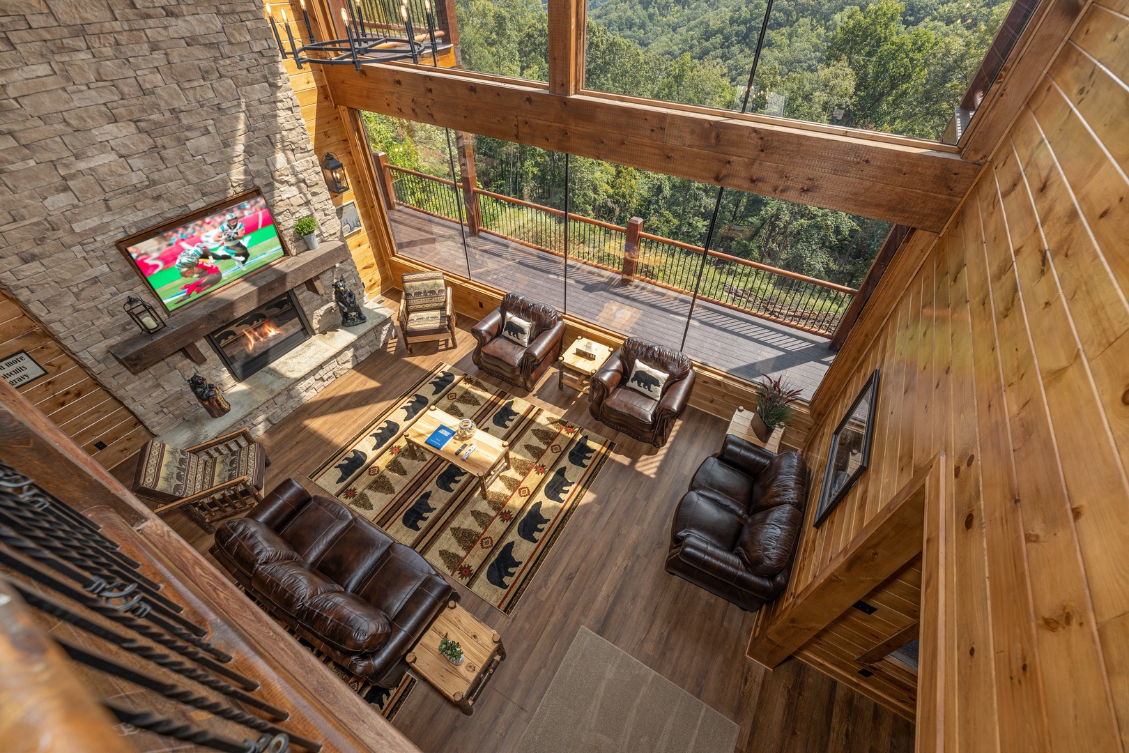 Looking down at the living room at Black Bears & Biscuits Lodge, a 6 bedroom cabin rental located in Pigeon Forge