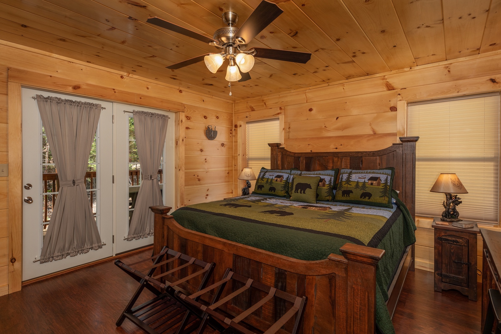 Bedroom with a king bed, night stands, and lamps at Gar Bear's Hideaway, a 3 bedroom cabin rental located in Pigeon Forge