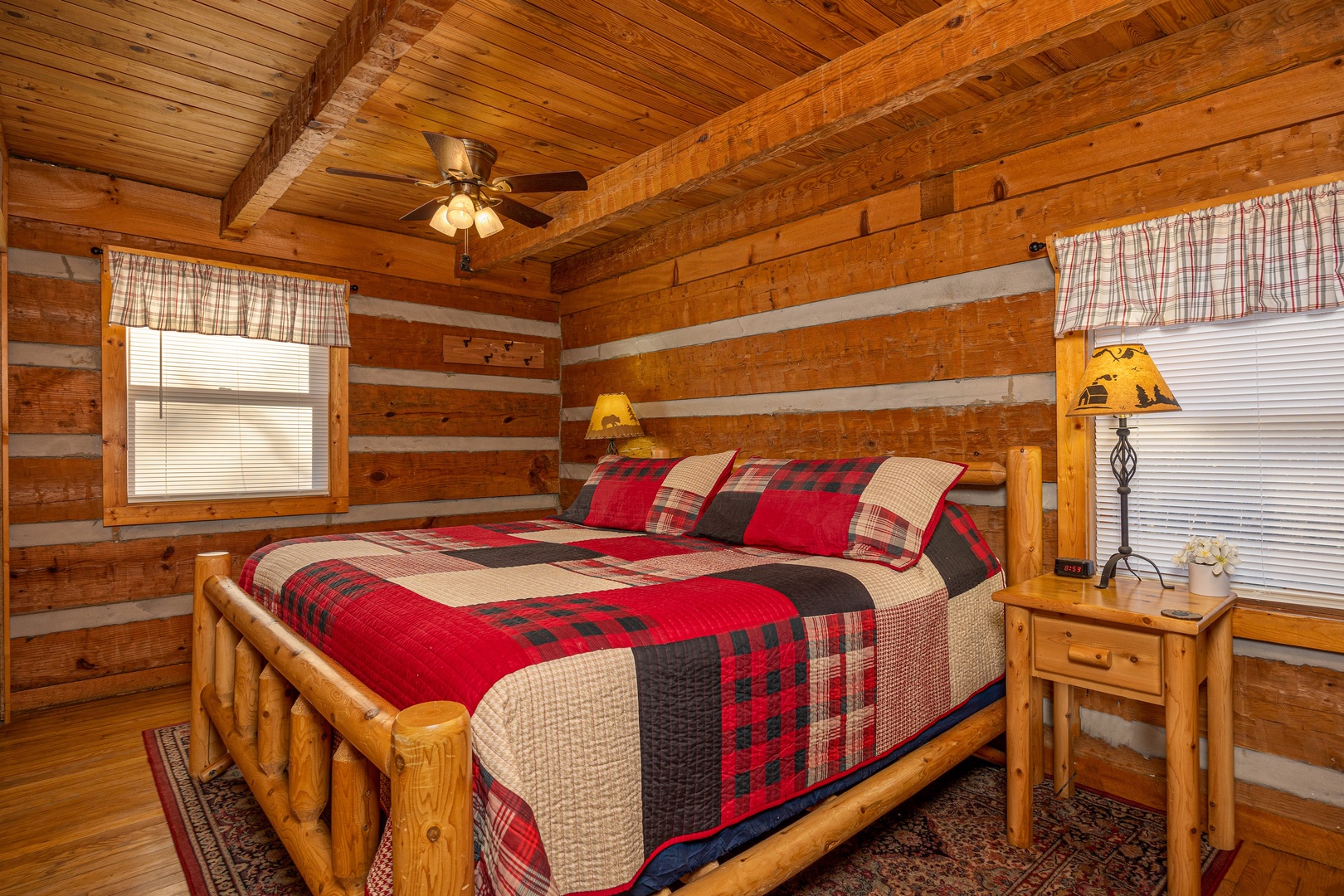 Log king bed at Little Bear, a 1 bedroom cabin rental located in Pigeon Forge