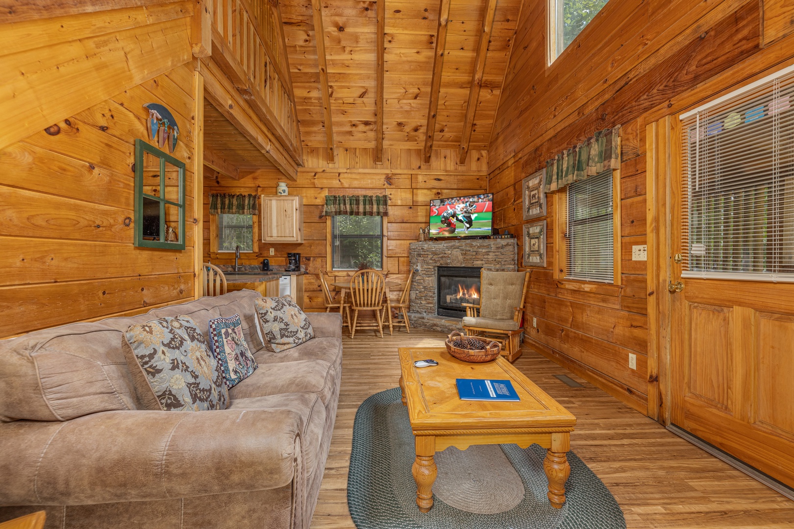 Living room with TV and fireplace at Walkin' To Gatlinburg, a 2 bedroom cabin rental located in Gatlinburg