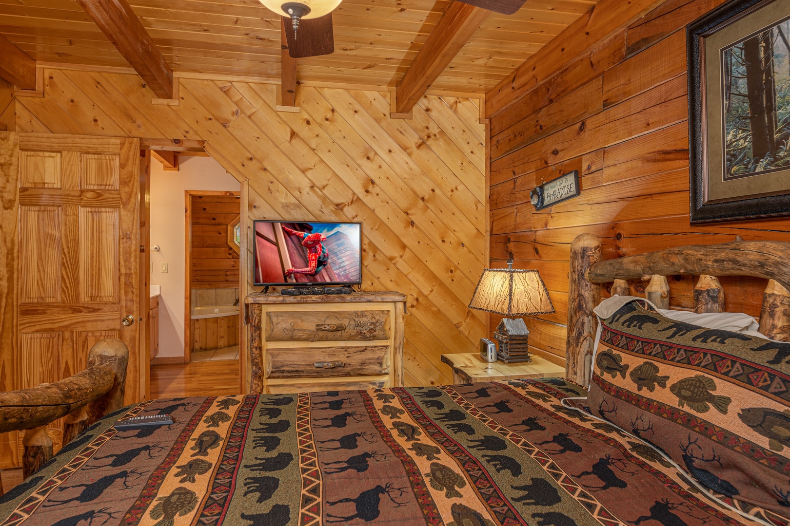 Dresser and TV in a bedroom at Almost Bearadise, a 4 bedroom cabin rental located in Pigeon Forge