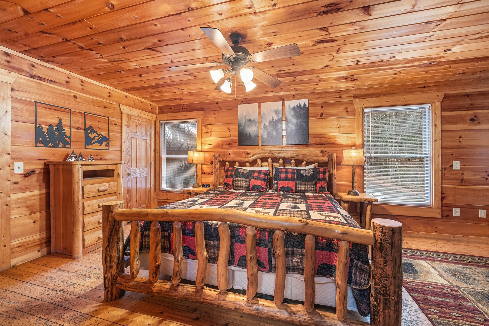 Bedroom with a log bed, night stands, and lamps at Moonshine Memories, a 2 bedroom cabin rental located in Gatlinburg