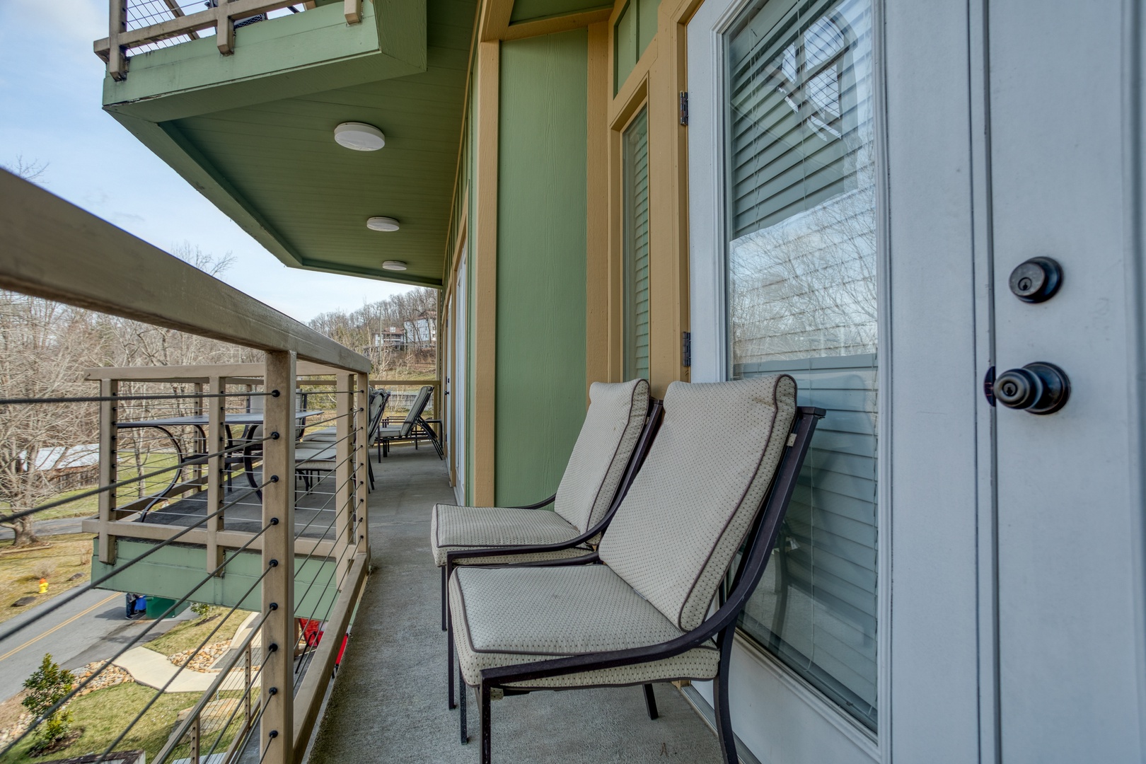 Two chairs on the balcony at Heart of Gatlinburg, a 2 bedroom cabin rental located in Gatlinburg