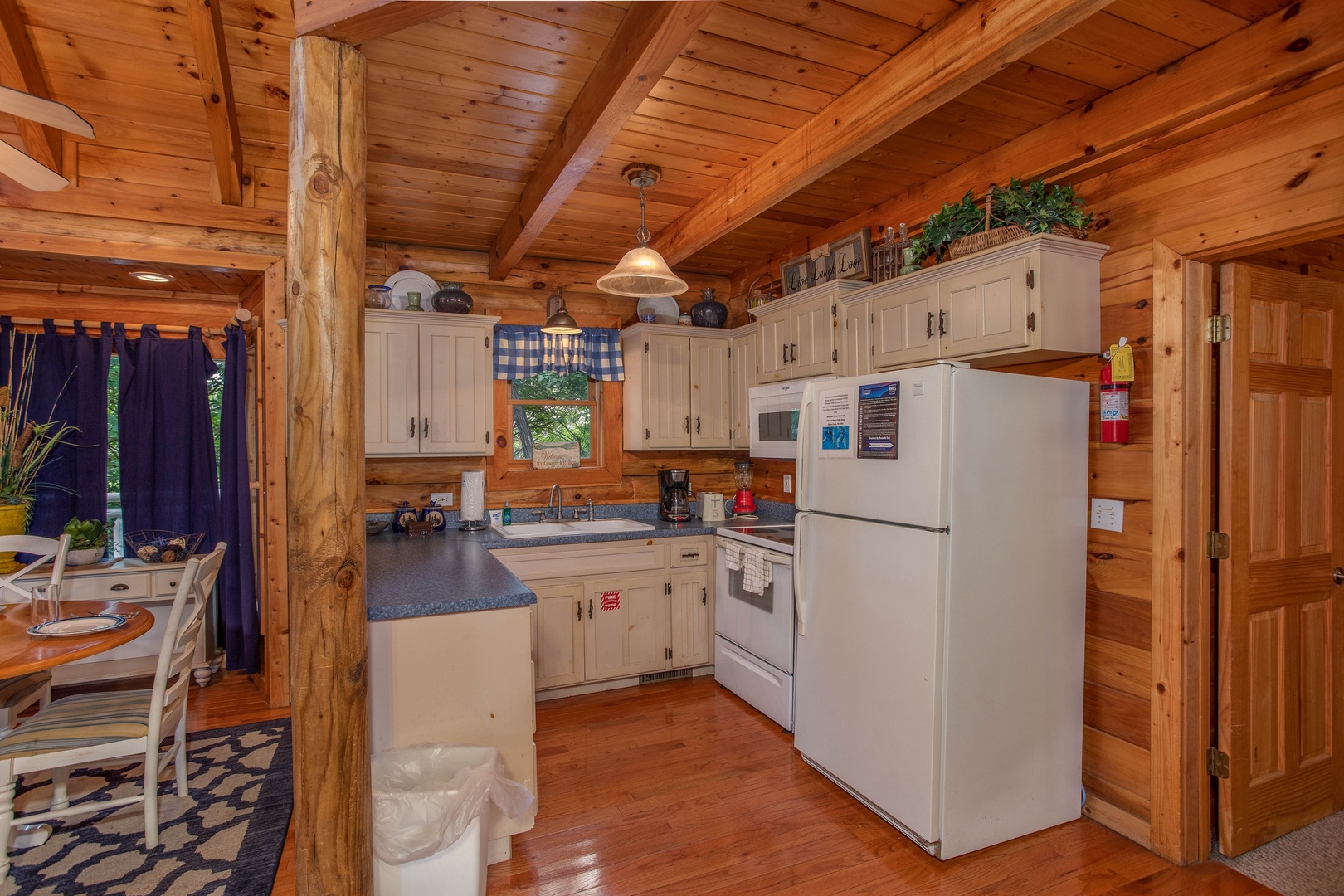 kitchen with white appliances at alpine something blue a 1 bedroom cabin rental located in pigeon forge