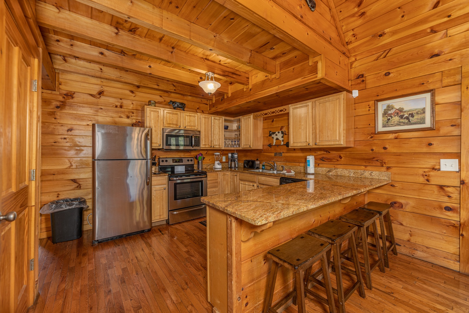 Kitchen with stainless appliances at Family Getaway, a 4 bedroom cabin rental located in Pigeon Forge