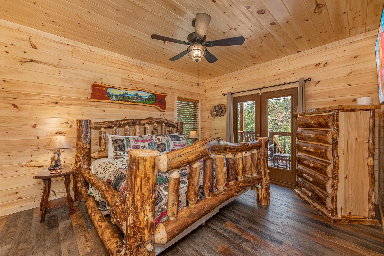 Log bed and dresser at Twin Peaks, a 5 bedroom cabin rental located in Gatlinburg
