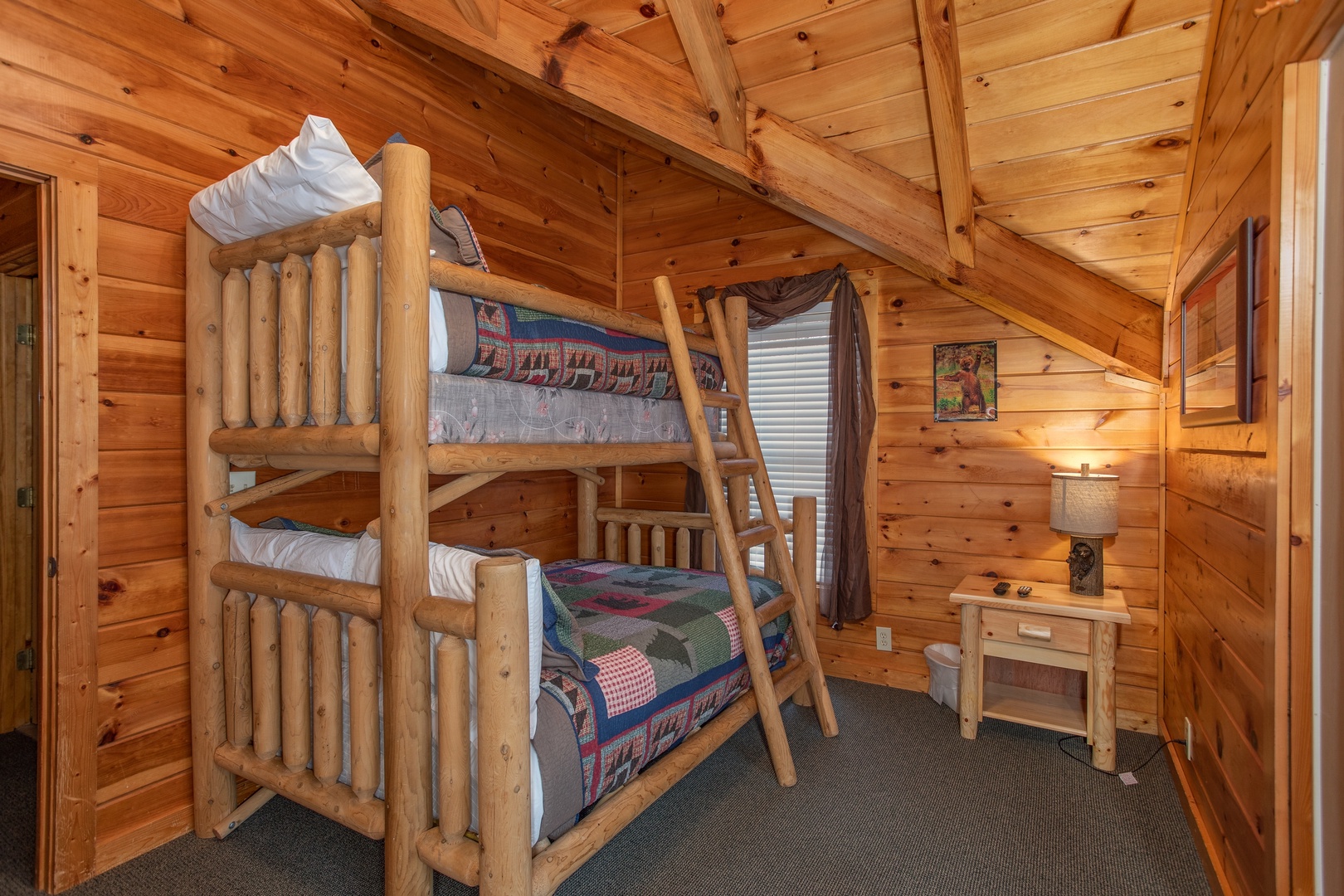 Bedroom with a full and twin bunk bed at Mountain Music, a 5 bedroom cabin rental located in Pigeon Forge