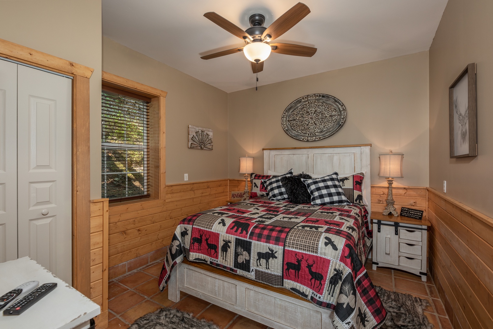 Bedroom with rustic furniture at Hawk's Heart Lodge, a 3 bedroom cabin rental located in Pigeon Forge