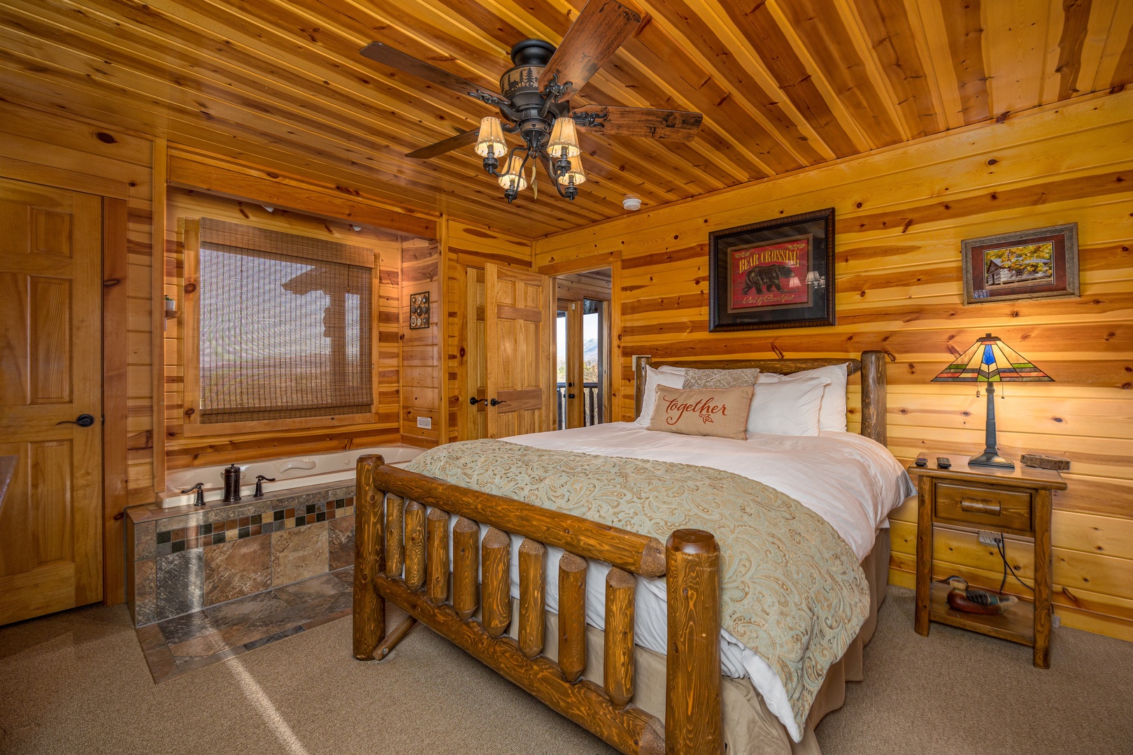 Bedroom with jacuzzi at Gone To Therapy, a 2 bedroom cabin rental located in Gatlinburg