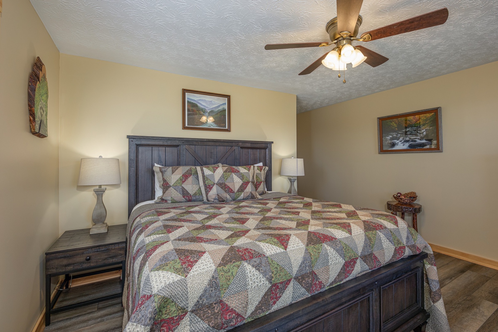 Bedroom with two night stands and lamps at Le Bear Chalet, a 7 bedroom cabin rental located in Gatlinburg