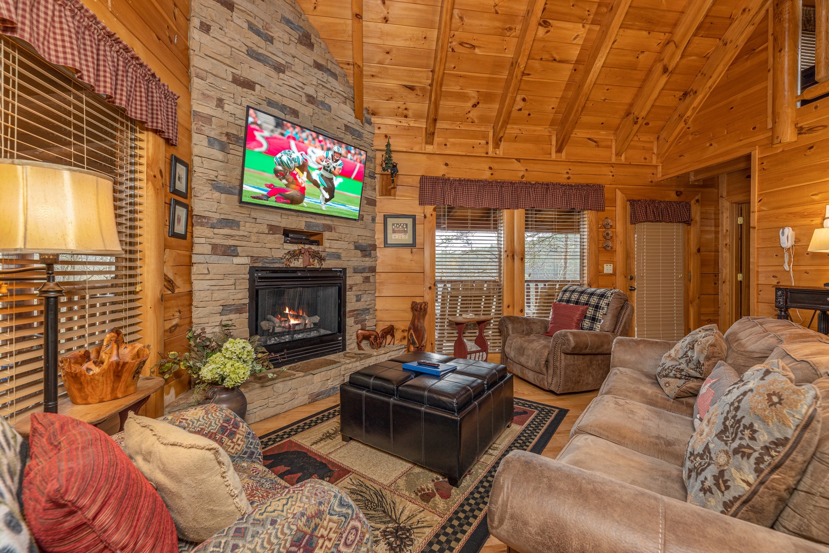 Fireplace and TV in a living room at Absolutely Wonderful, a 2 bedroom cabin rental located in Pigeon Forge