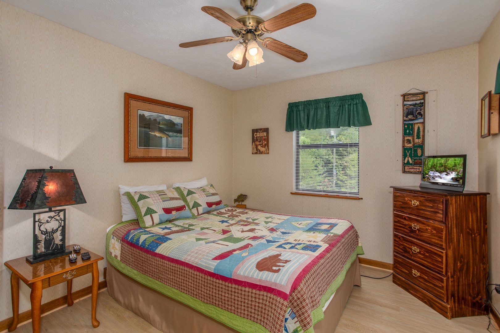 Bedroom with a dresser and television at Black Bear Ridge, a 3-bedroom cabin rental located in Pigeon Forge