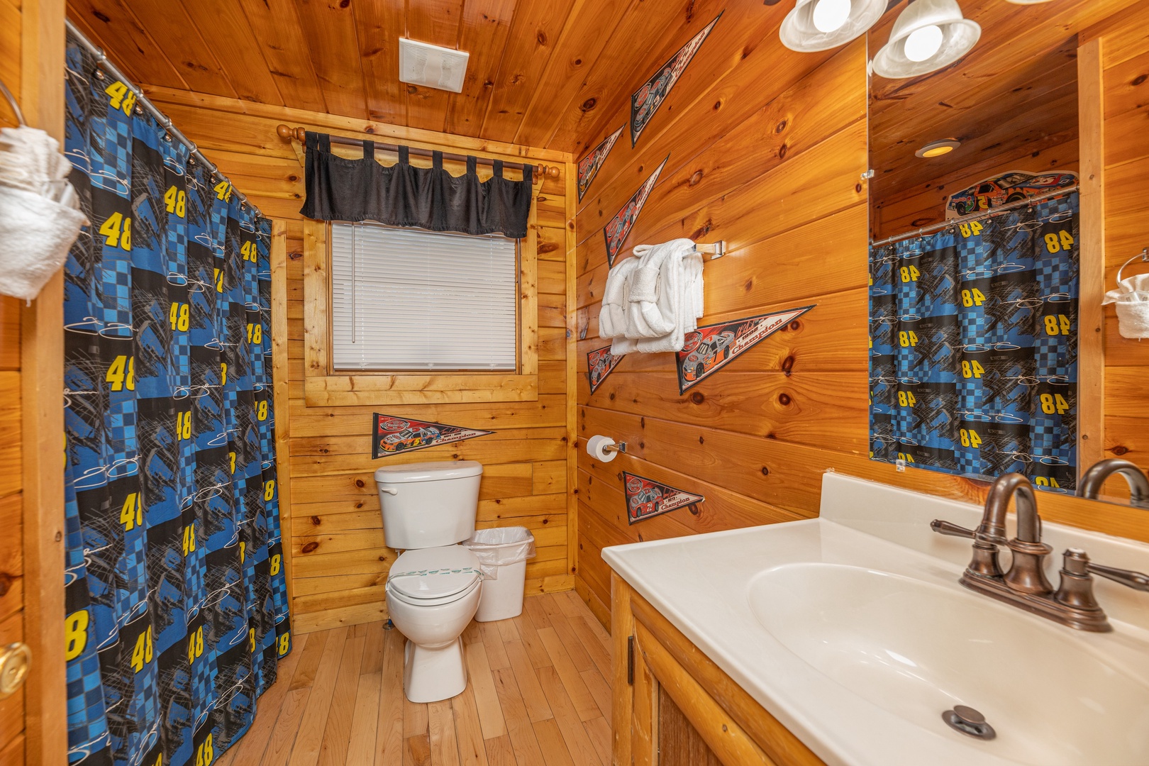 Bathroom with shower and tub at Nascar Nation, a 2 bedroom cabin rental located in Pigeon Forge