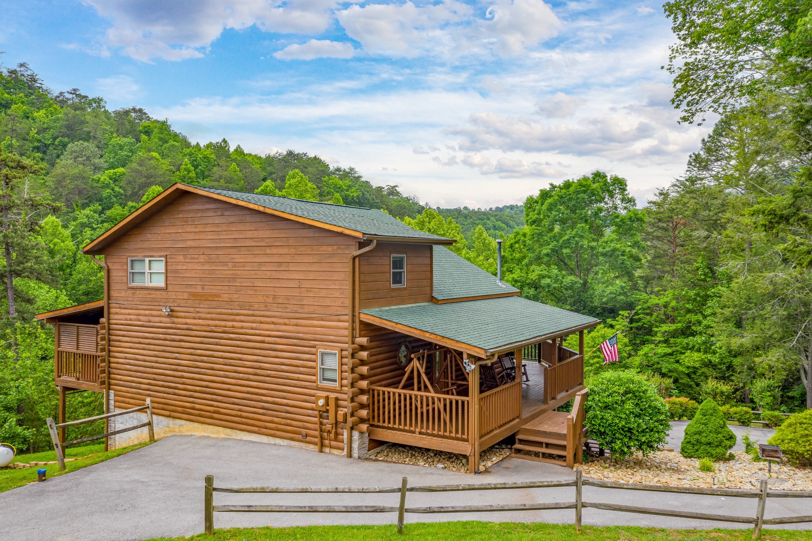 Driveway and fence at Almost Bearadise, a 4 bedroom cabin rental located in Pigeon Forge