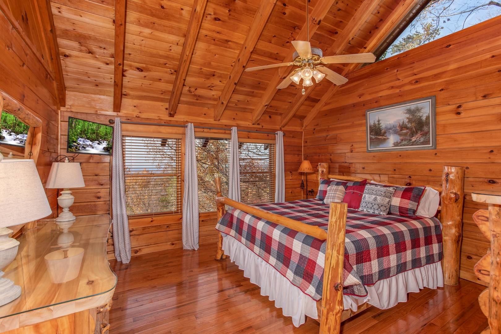 Custom log bed in a loft bedroom at The Original American Dream, a 2 bedroom cabin rental located in Gatlinburg
