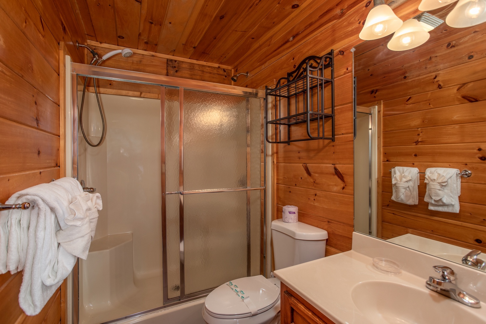 Shower in a bathroom on the main floor at Mountain Music, a 5 bedroom cabin rental located in Pigeon Forge