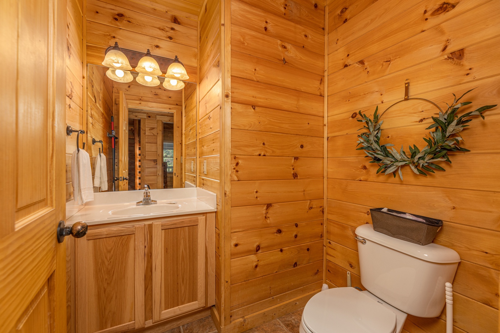 Half bath at Happy Hideaway, a 4 bedroom cabin rental located in Pigeon Forge