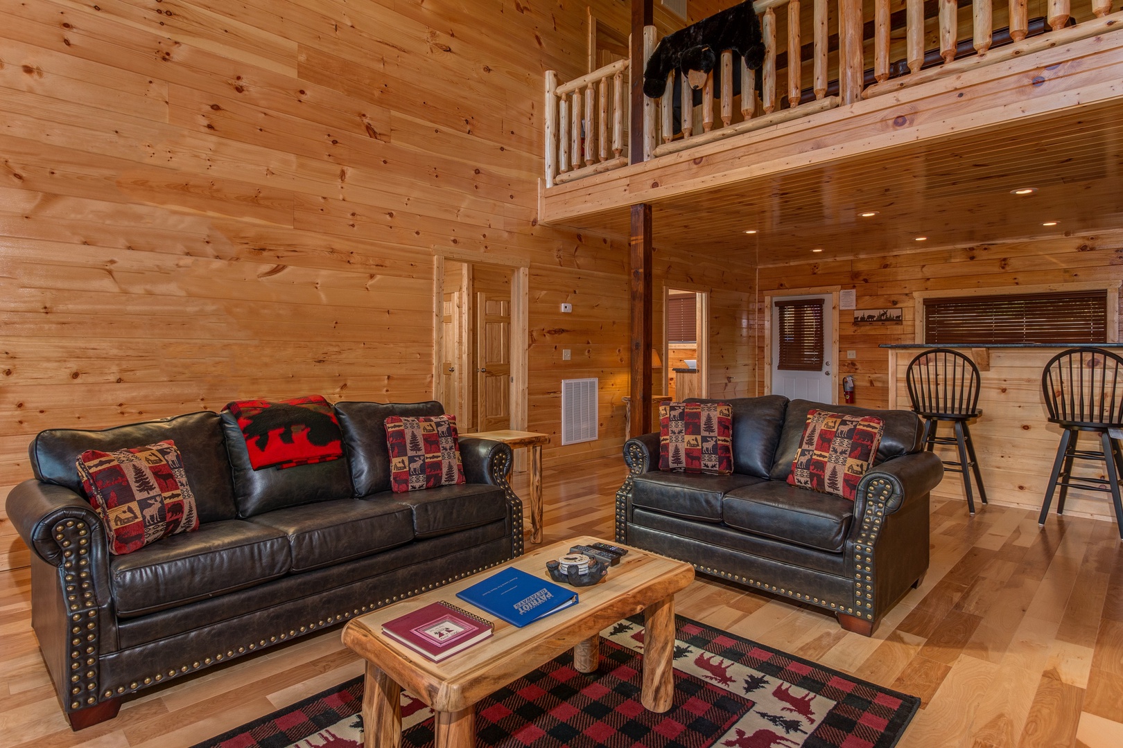 Sofa and loveseat in the living room at Canyon Camp Falls, a 2 bedroom cabin rental located in Pigeon Forge