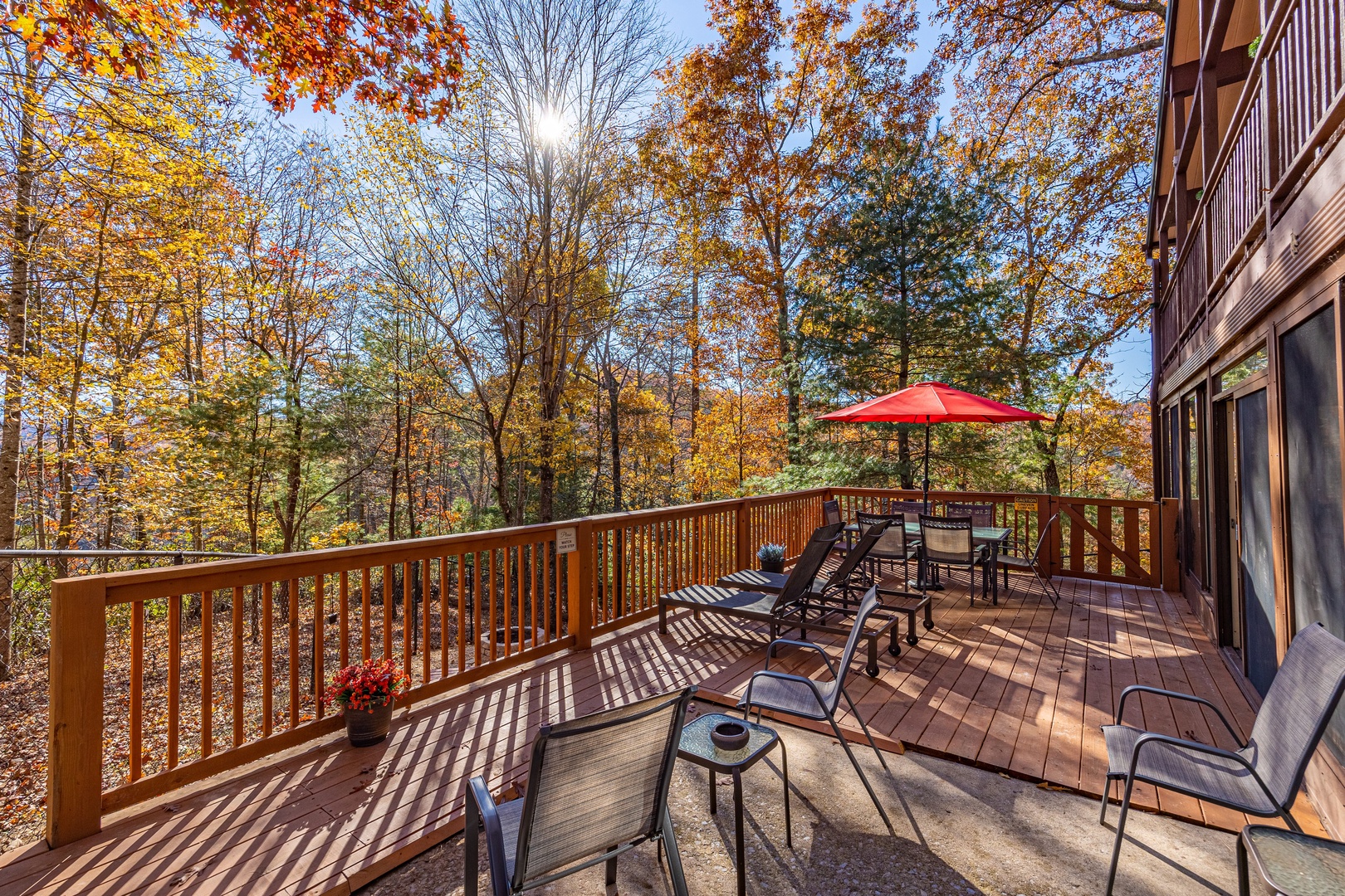 Deck with seating and table at Buena Vista Getaway, a 3 bedroom cabin rental located in gatlinburg