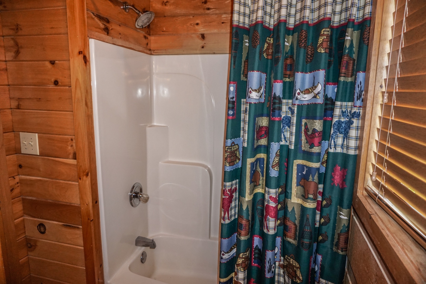 Tub and shower combination in the bathroom at Seclusion, a 1 bedroom cabin rental located in Gatlinburg
