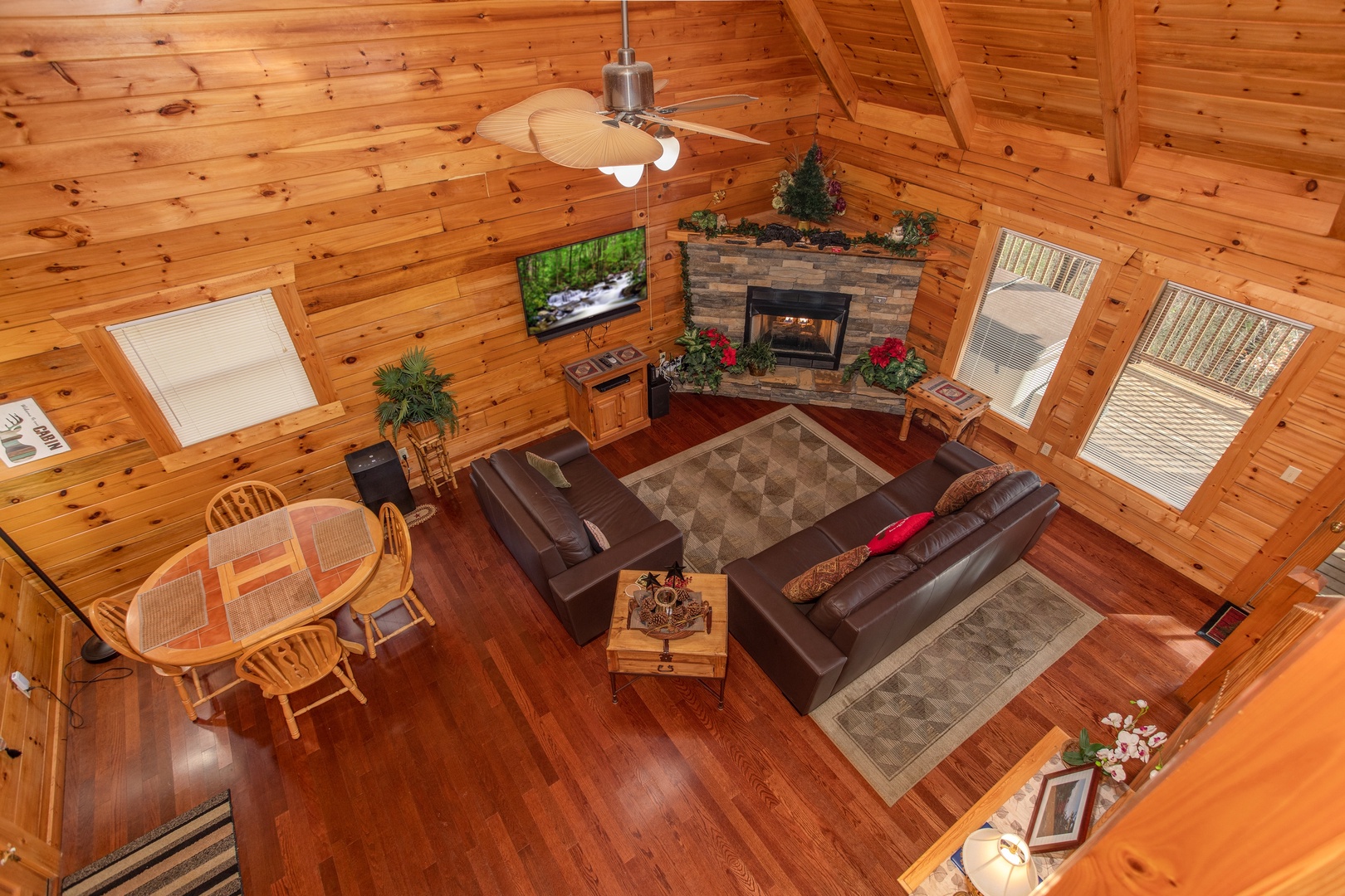 Looking down into the living room from the upper floor at Enchanted Evening, a 1 bedroom Pigeon Forge cabin rental