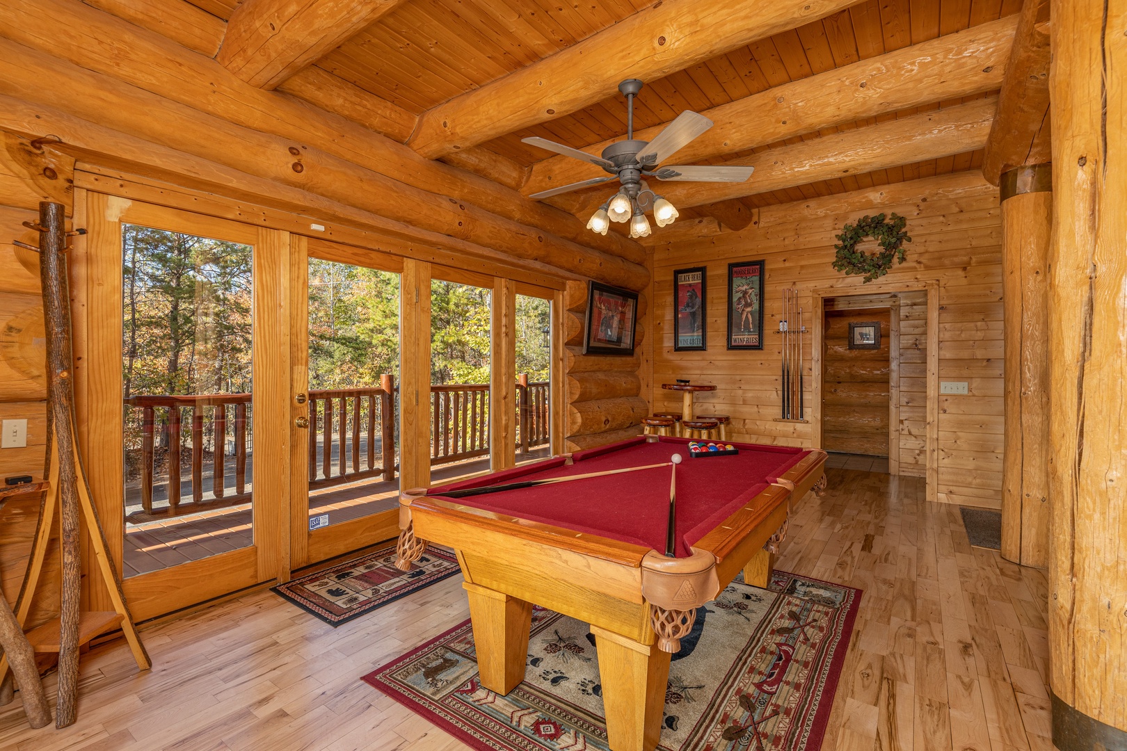 Red felt pool table at Grizzly's Den, a 5 bedroom cabin rental located in Gatlinburg