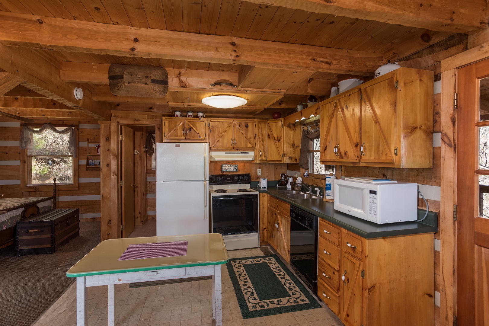 Kitchen with black and white appliances at Mountain Glory, a 1 bedroom cabin rental located in Pigeon Forge