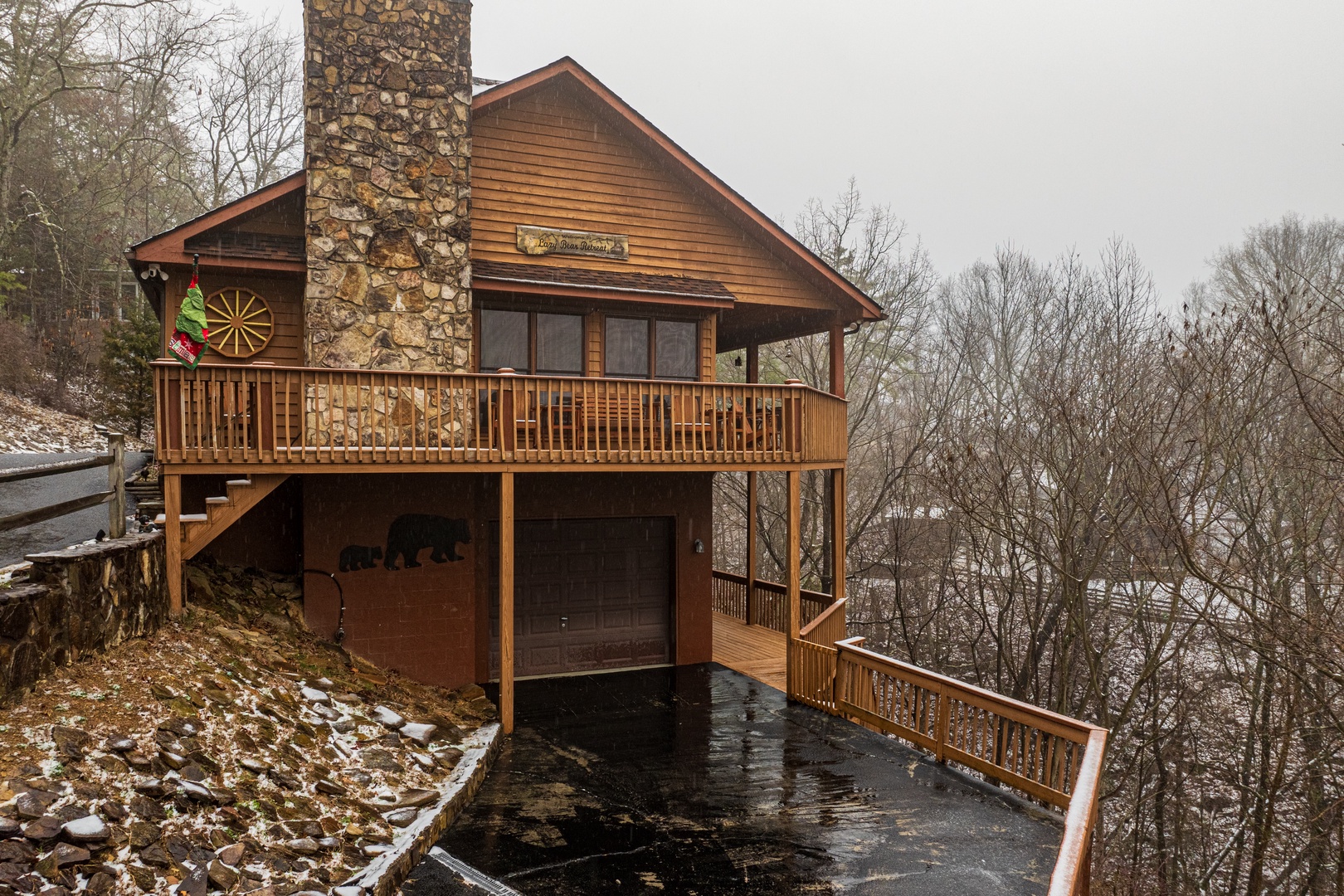 Driveway and front of cabin in winter at Lazy Bear Retreat, a 4 bedroom cabin rental located in Pigeon Forge