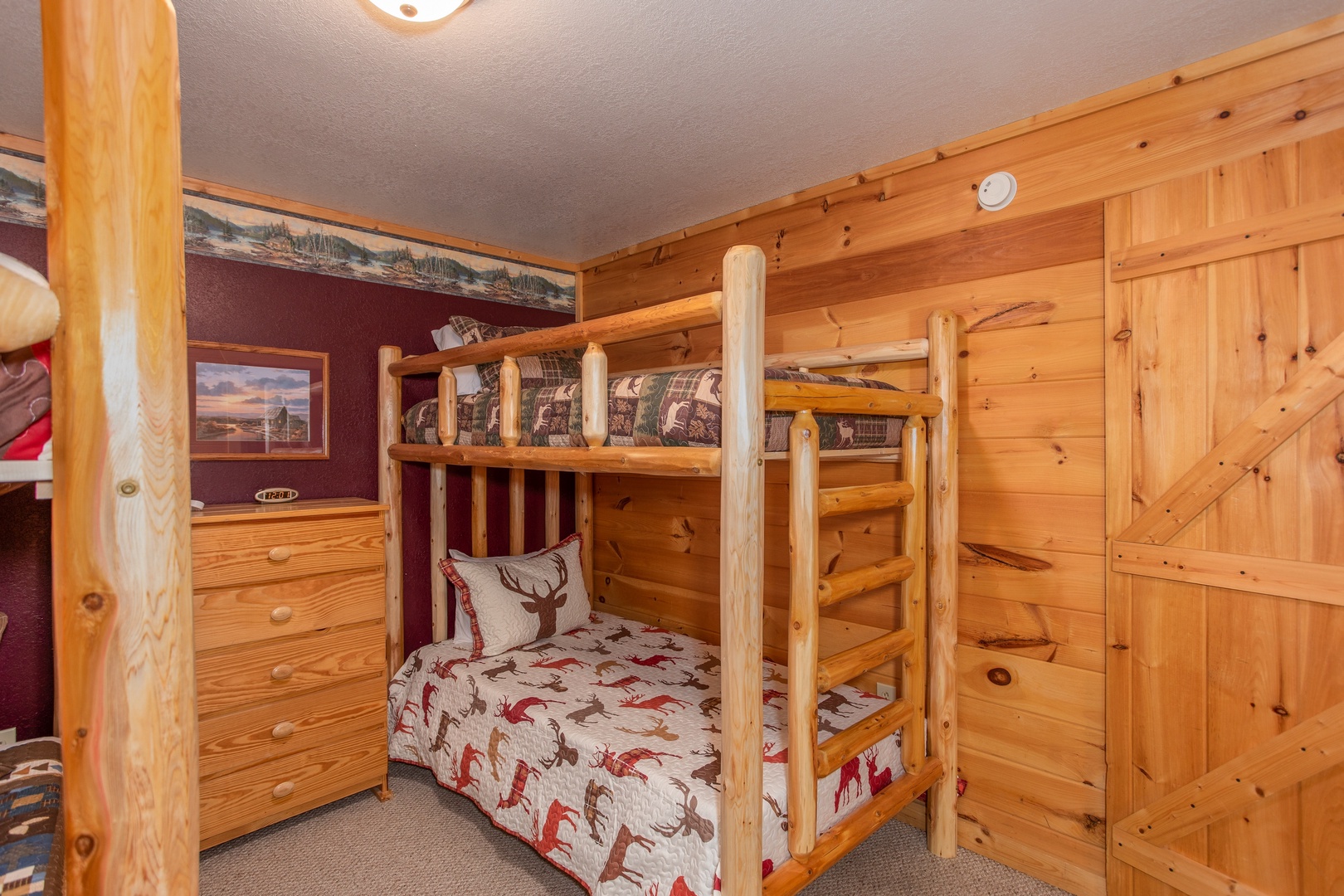 Room with two sets of twin bunk beds at Bearly in the Mountains, a 5-bedroom cabin rental located in Pigeon Forge