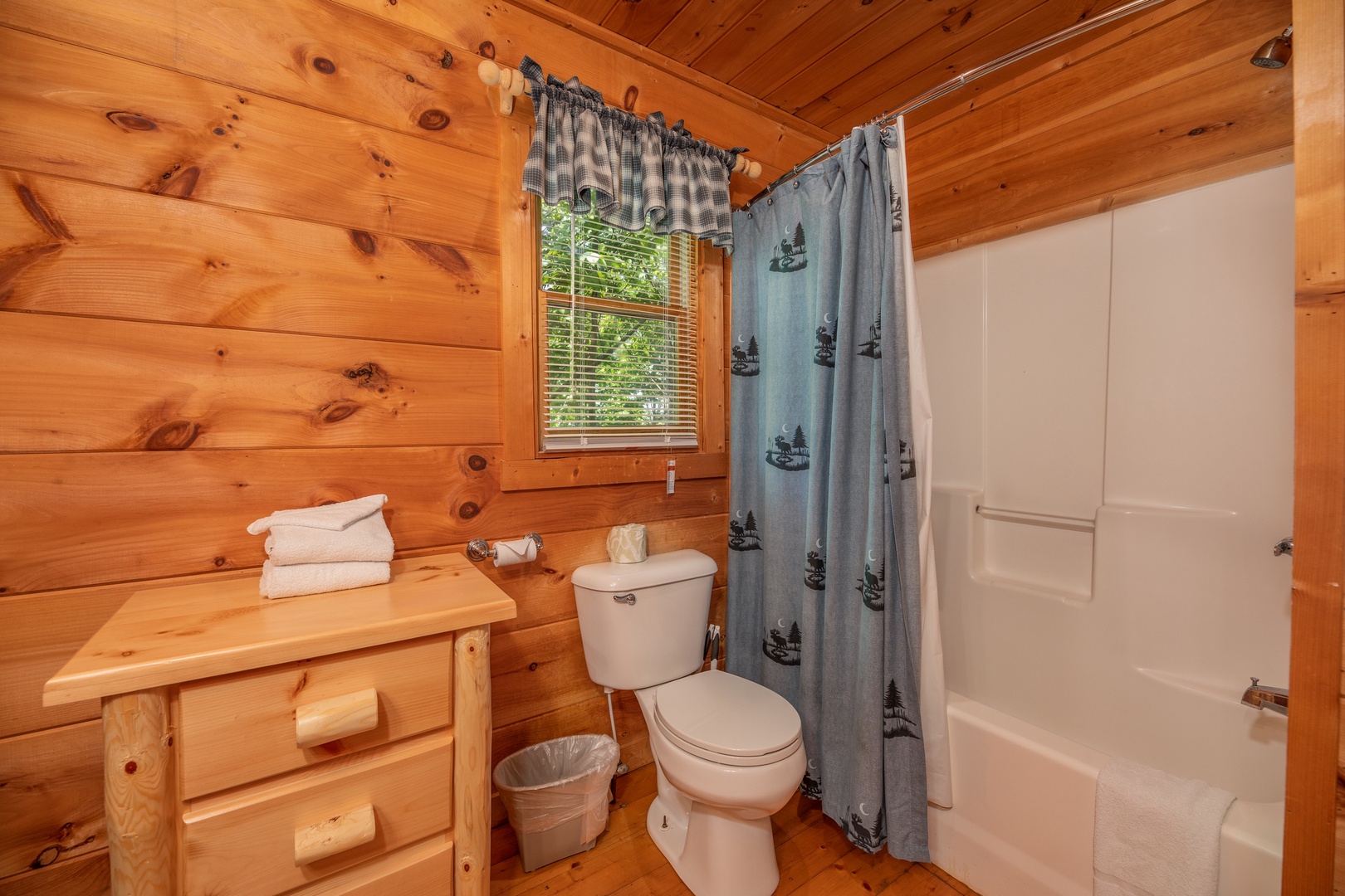 Bathroom with a tub and shower at Misty Mountain Escape, a 2 bedroom cabin rental located in Gatlinburg