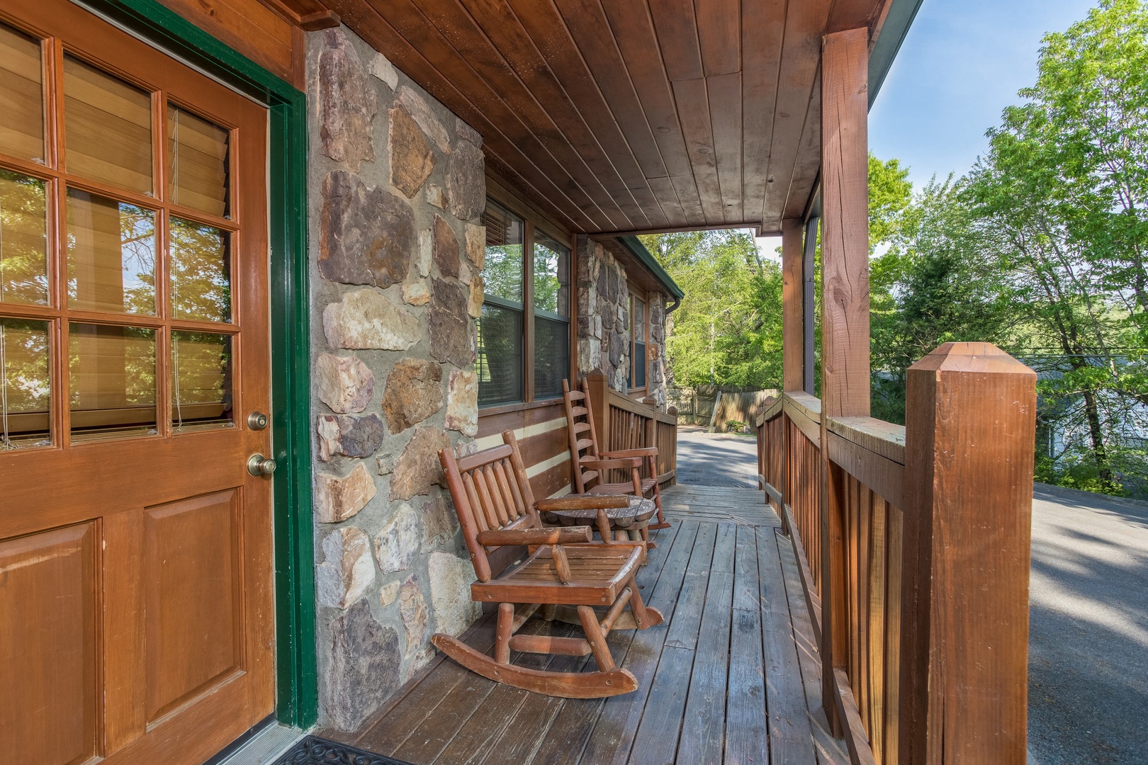 Covered front porch at Patriot Pointe, a 5 bedroom cabin rental located in Pigeon Forge
