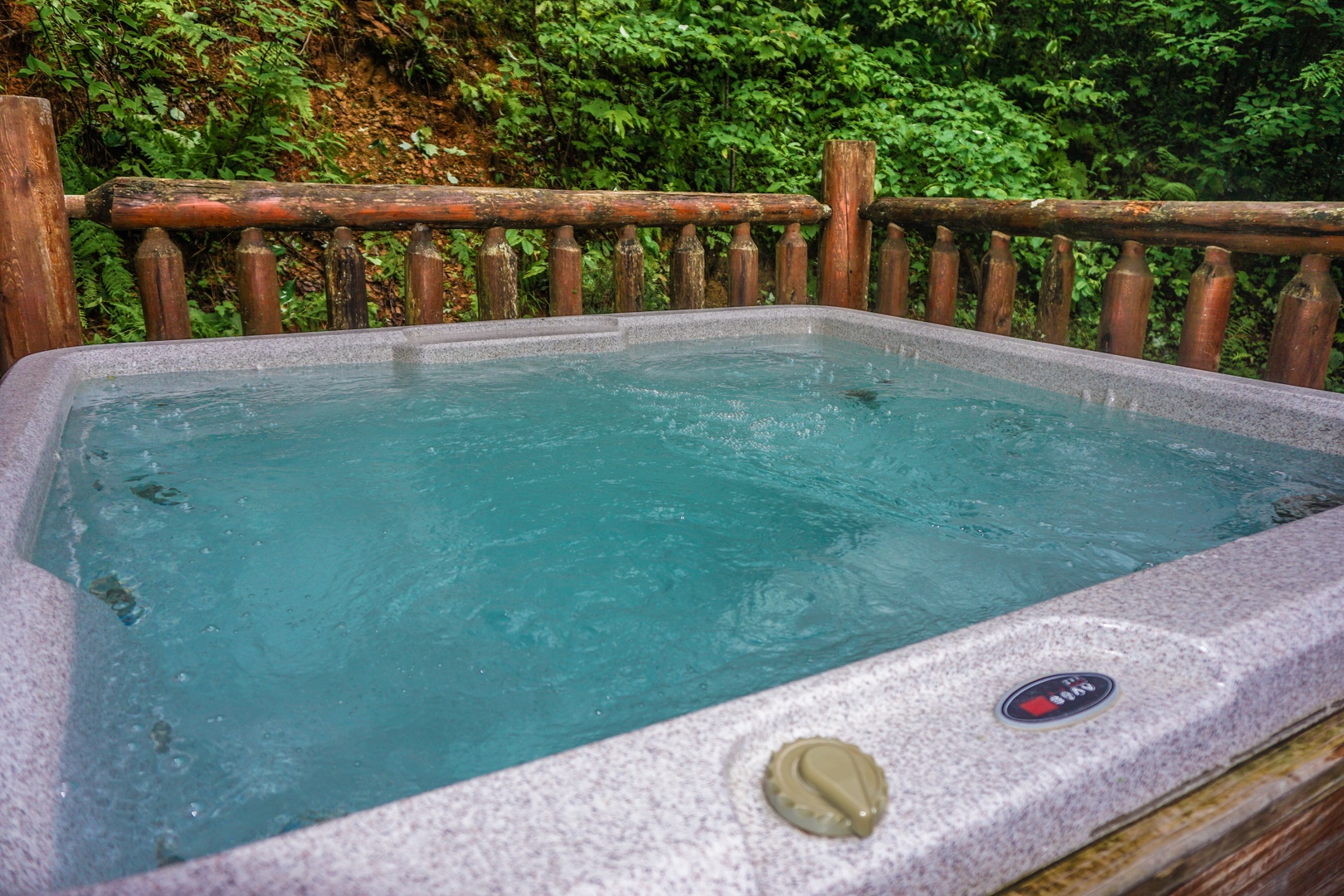 Hot tub at Just You and Me Baby, a 1 bedroom cabin rental located in Gatlinburg
