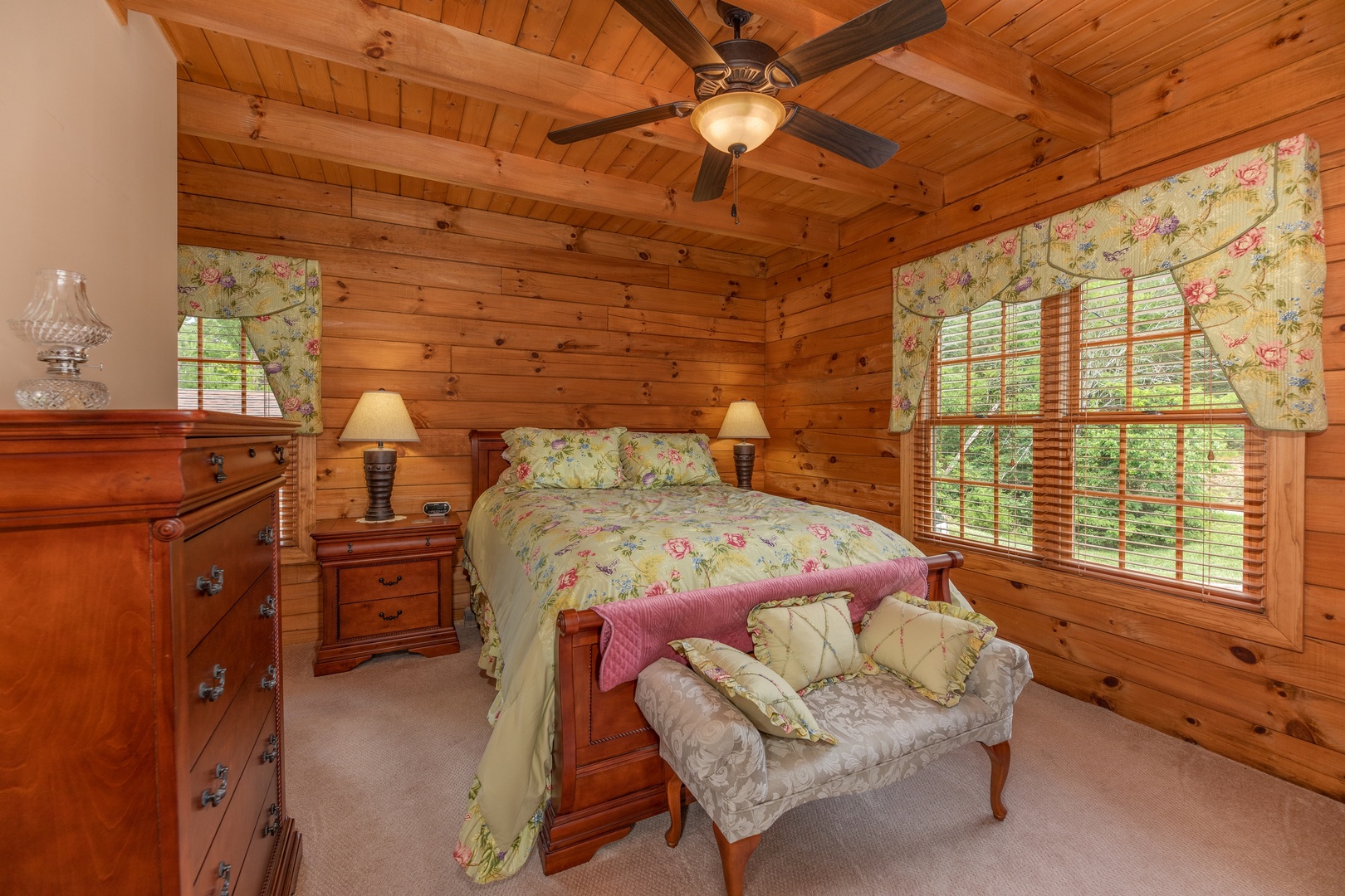 Bedroom with a bed, end tables, lamps, and a dresser at Mountain Lake Getaway, a 3 bedroom cabin rental located at Douglas Lake