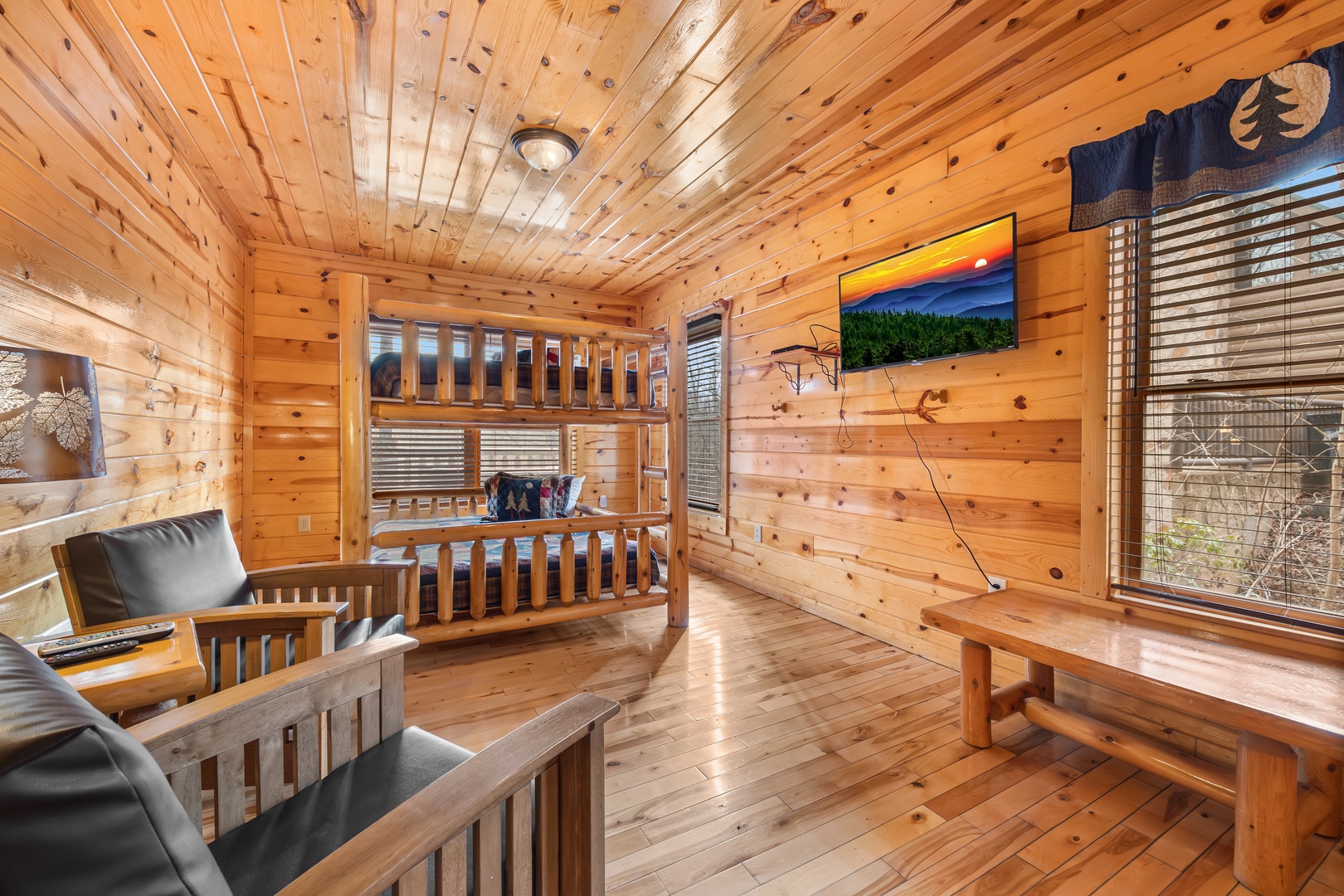 First floor queen bunk beds and flat screen at Natural Wonder, a 4 bedroom cabin rental located in Gatlinburg