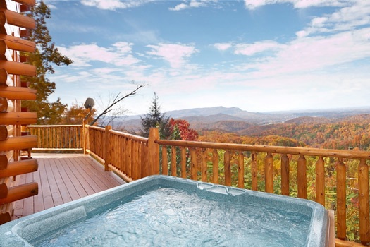 Deck with hot tub at The Original American Dream, a 2 bedroom cabin rental located in Gatlinburg