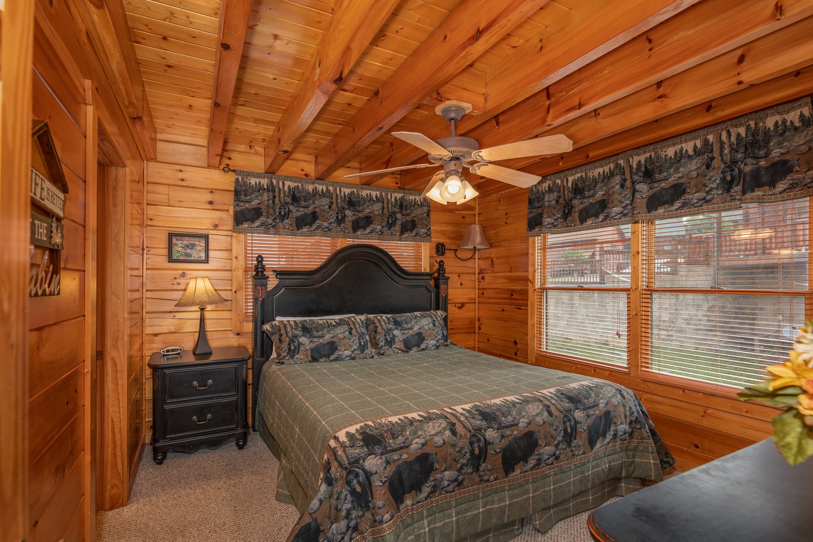 Bedroom with night stand and lamp at 1 Above the Smokies, a 2 bedroom cabin rental located in Pigeon Forge