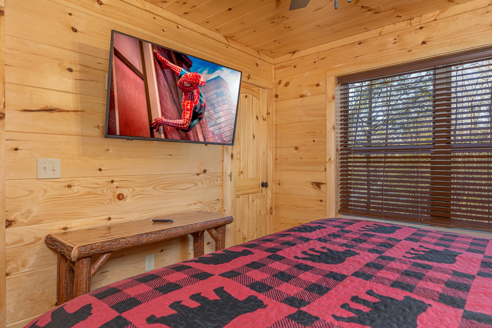 Bedroom with a table and TV at Bessy Bears Cabin, a 2 bedroom cabin rental located inGatlinburg