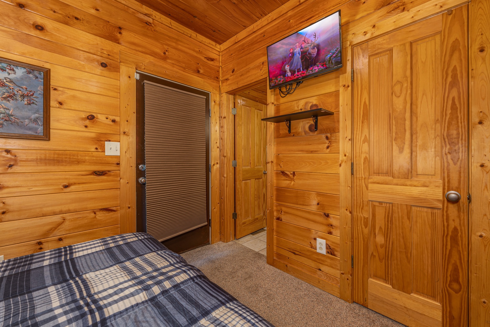 TV in a bedroom at Family Getaway, a 4 bedroom cabin rental located in Pigeon Forge