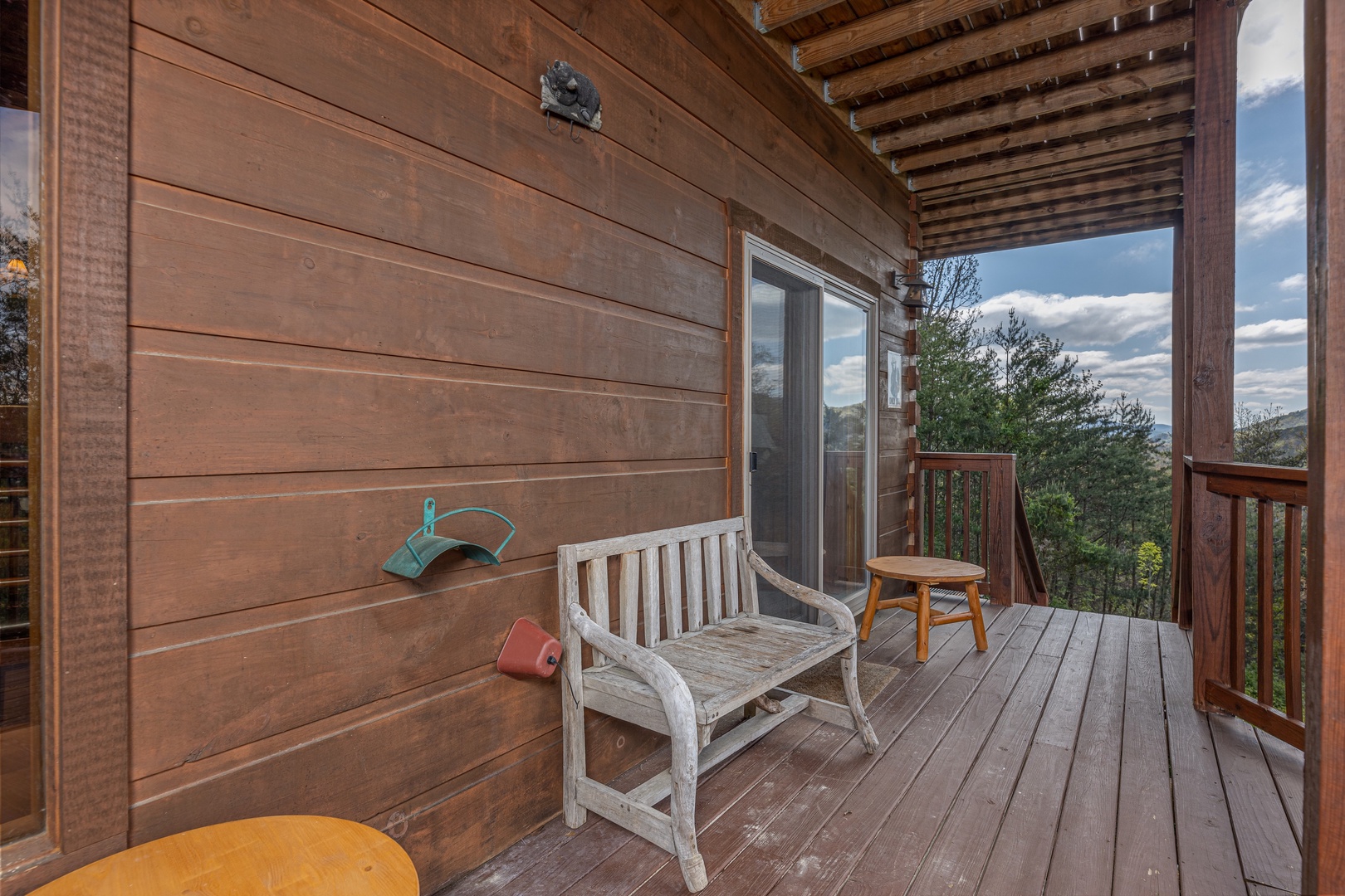 Deck bench at Mountain Laurel Lodge, a 4 bedroom cabin rental located in Pigeon Forge