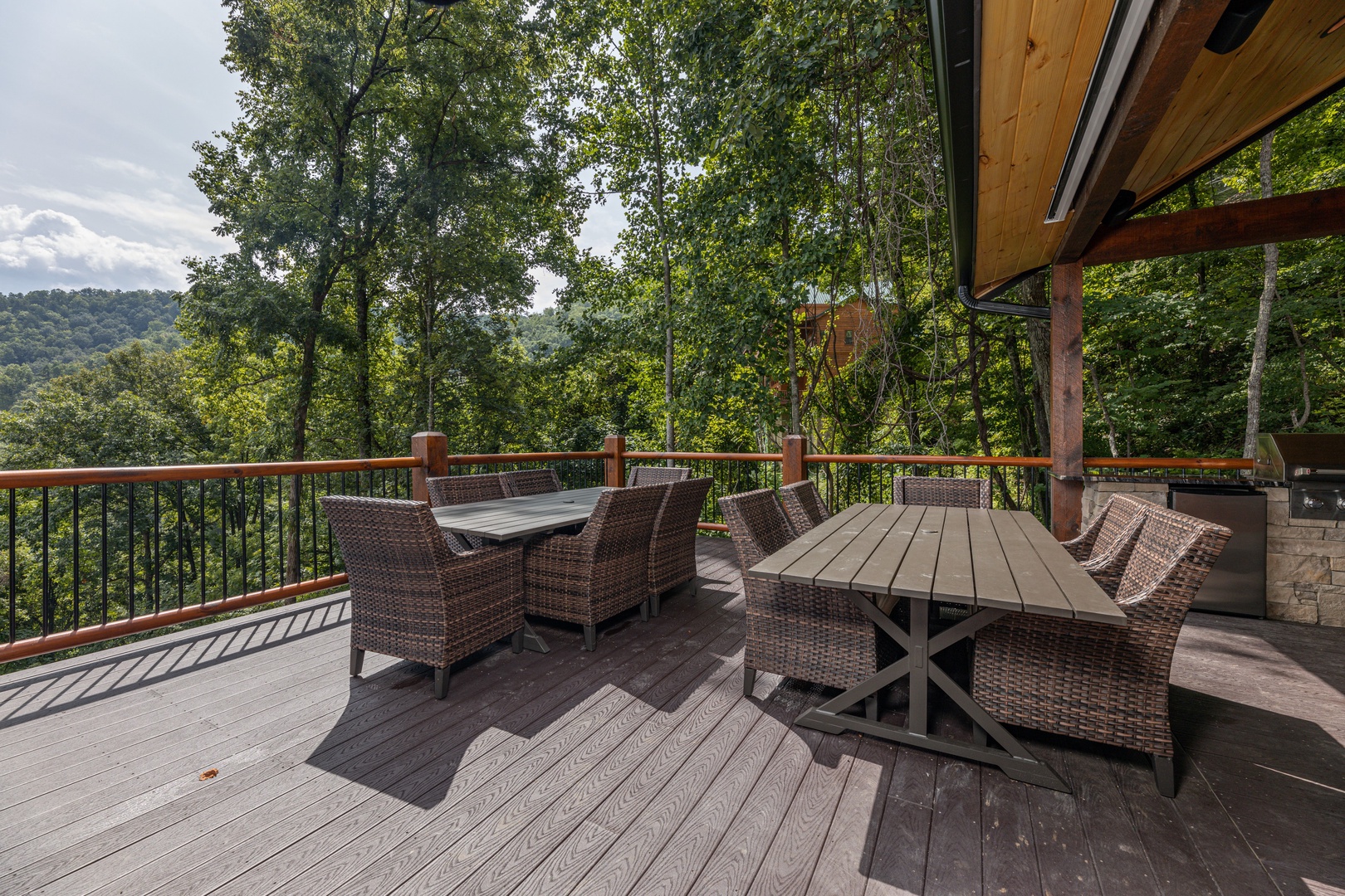 Outdoor dining tables at Black Bears & Biscuits Lodge, a 6 bedroom cabin rental located in Pigeon Forge