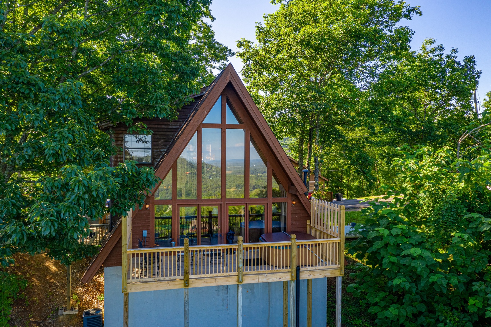 Exterior deck view at Cozy Mountain View, a 1 bedroom cabin rental located in Pigeon Forge