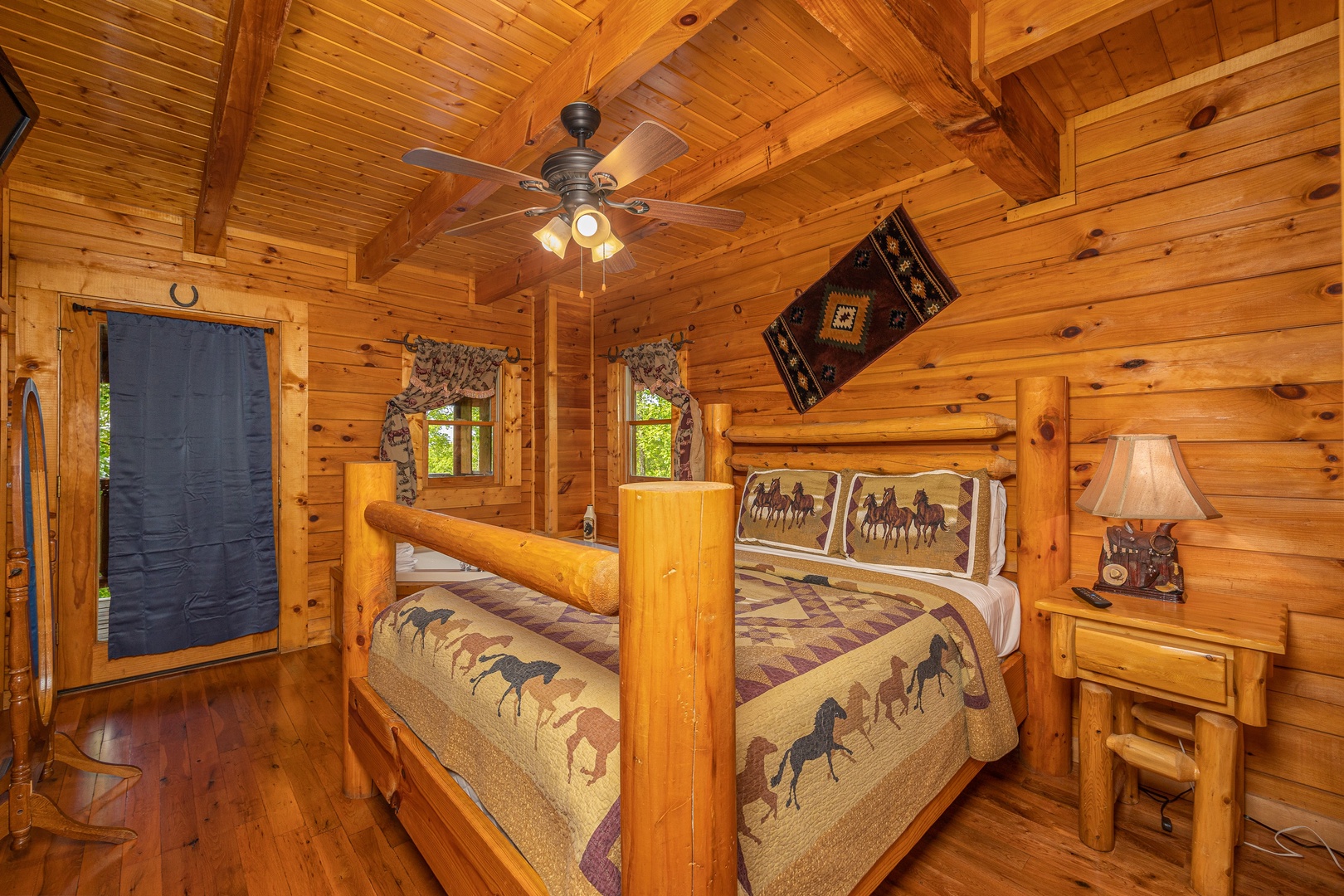 King bedroom with log furniture at Duke's Den