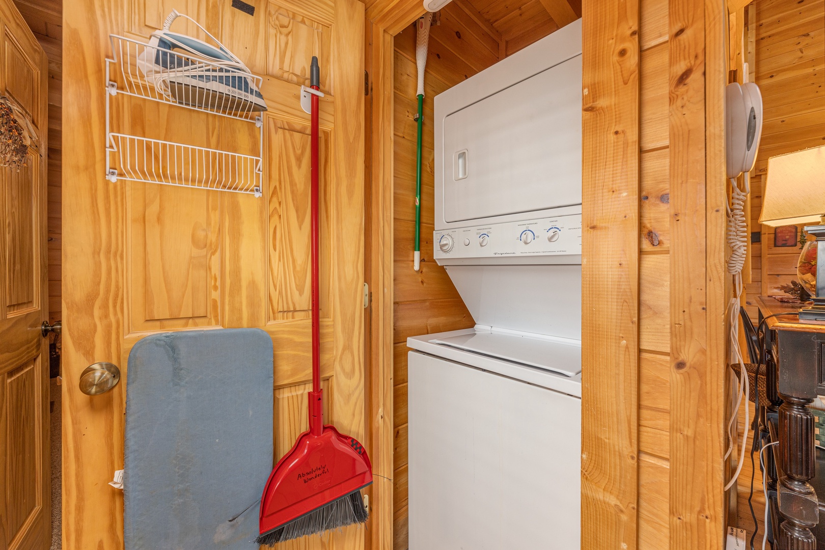 Stacked washer and dryer at Absolutely Wonderful, a 2 bedroom cabin rental located in Pigeon Forge