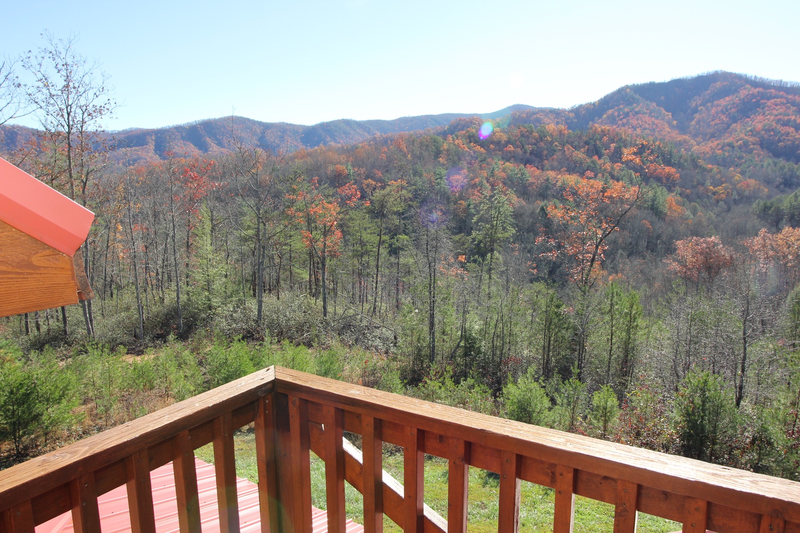 Fall colors as seen from the upper deck at Four Seasons Lodge, a 3-bedroom cabin rental located in Pigeon Forge