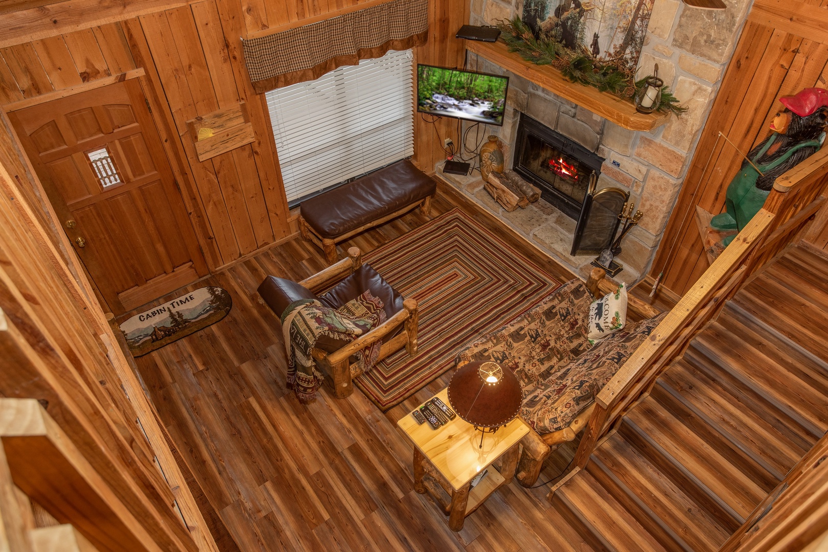 Looking down into the living room from the upper floor at Papa Bear, a 3 bedroom cabin rental located in Pigeon Forge
