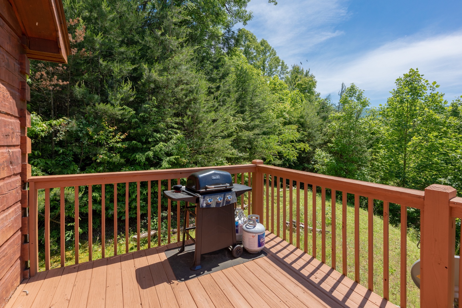 Gas grill on an open deck at Eagle's Loft, a 2 bedroom cabin rental located in Pigeon Forge