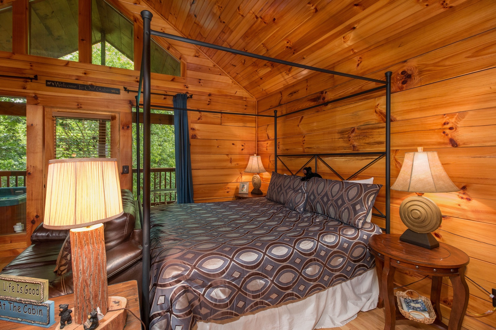Main bed in the studio style cabin at Kelly's Cabin, a 1 bedroom cabin rental located in Pigeon Forge