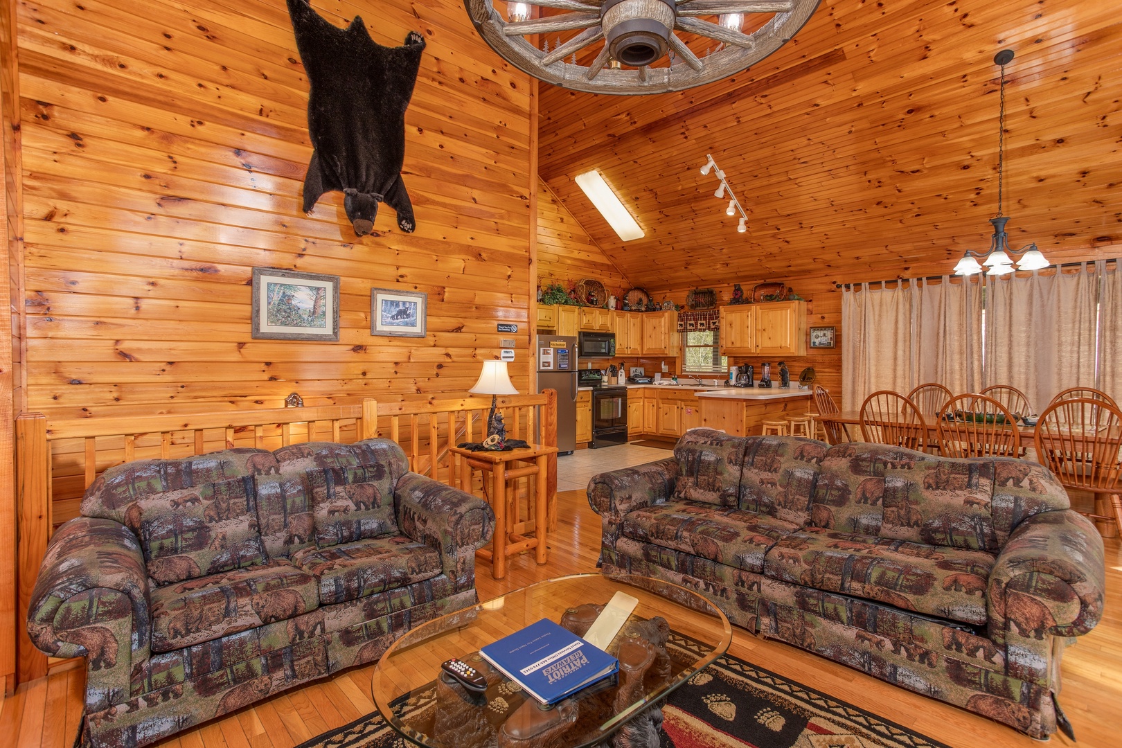 Couch and loveseat in the living room at Bear Country, a 3-bedroom cabin rental located in Pigeon Forge
