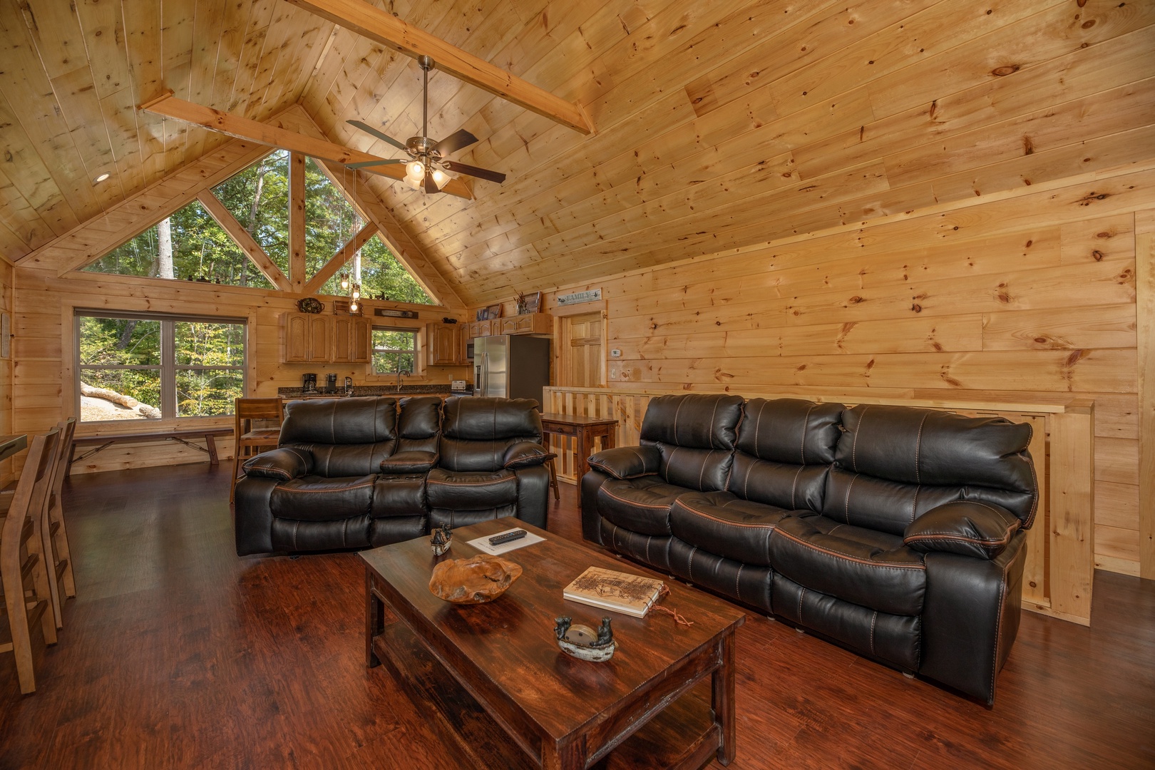 Leather loveseat and sofa in the living room at Gar Bear's Hideaway, a 3 bedroom cabin rental located in Pigeon Forge